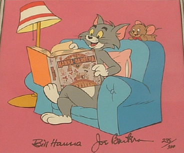 Tom and Jerry in armchair with book