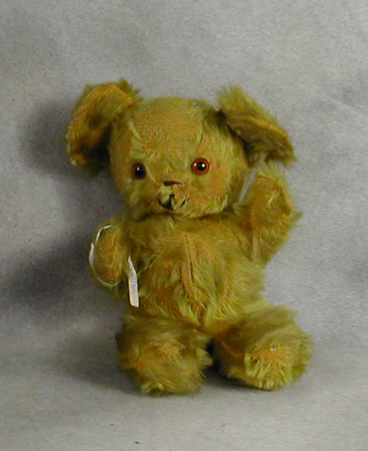 11 inch Knickerbocker bear with worn fur and brown eyes