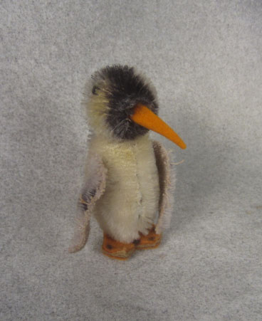 very small black and tan penguin