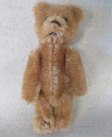 very small brown teddy bear