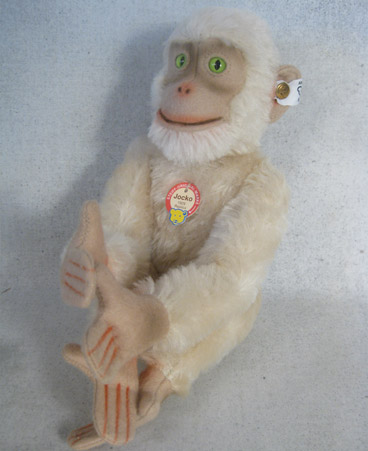 White mohair chimpanzee with green eyes