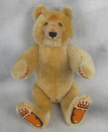 Large gold bear with painted paw pads