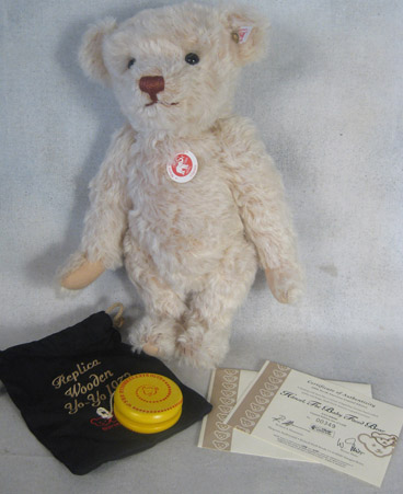 White bear with yellow wooden yo-yo