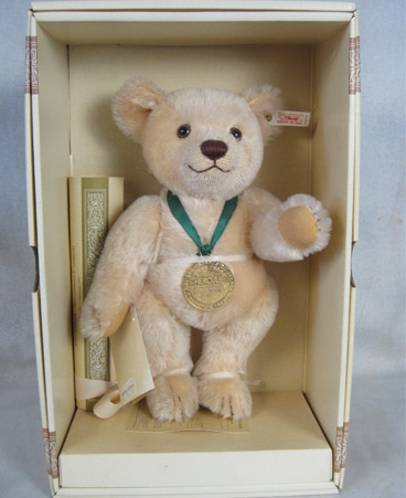 Tan teddy bear with medallion