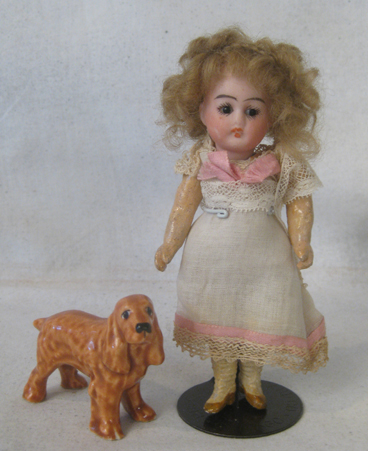 Miniature 5 inch German bisque doll, all original with glass eyes 18/0