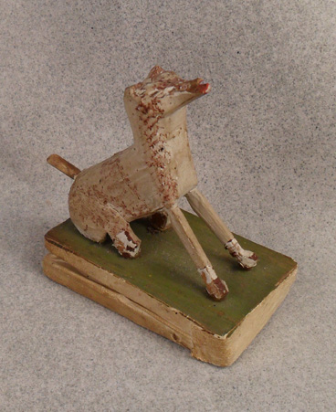 Wooden folk art dog squeak toy