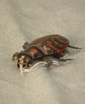 Colorful metal beetle on wheels