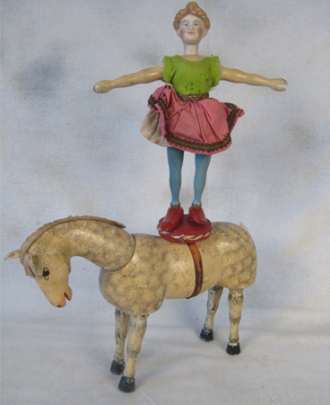 Schoenhut bisque-head acrobat with circus horse