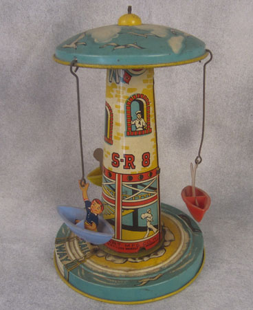 Tin lighthouse swing ride